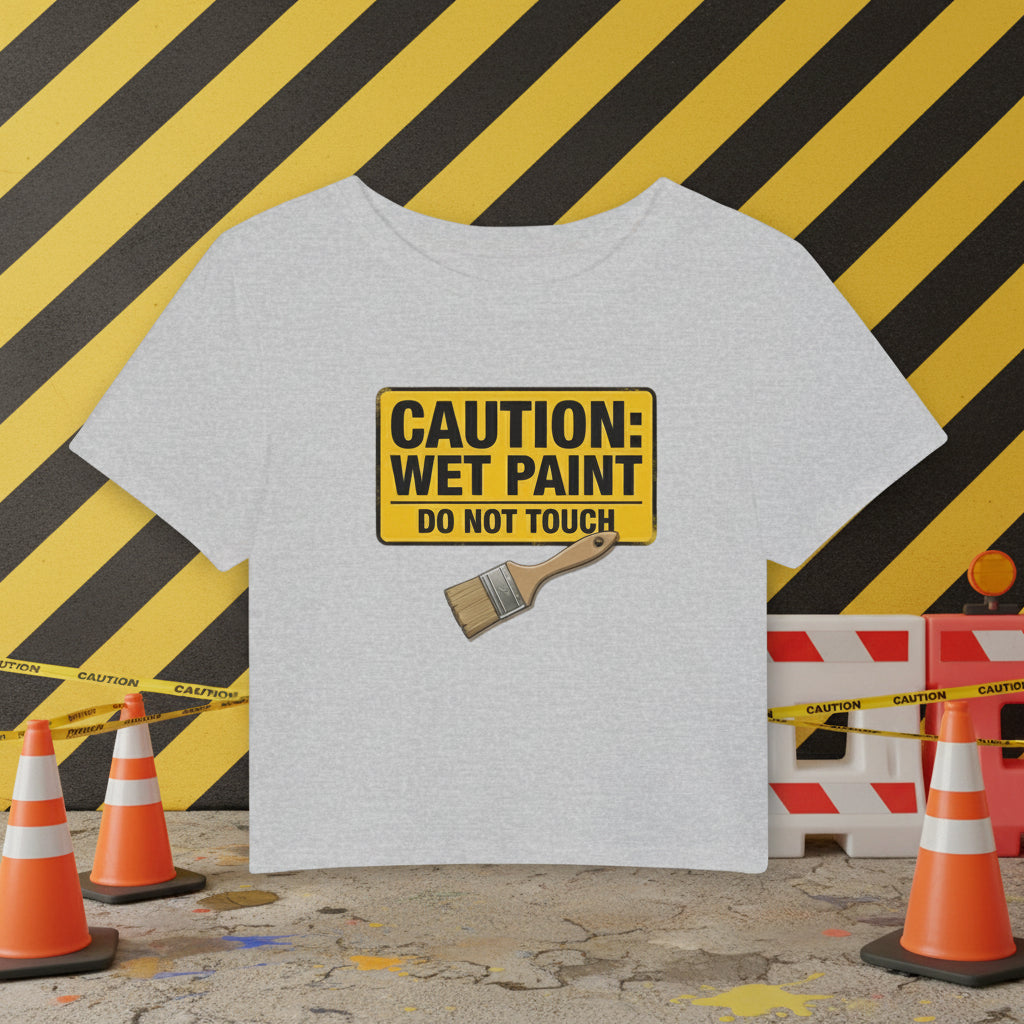 Gray cropped t-shirt with a yellow 'Caution: Wet Paint' sign and paintbrush on a white background